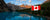 Canadian flag with a picturesque canadian scene behind to show the vivid and bright colours of FlagMart Canada's National Maple Leaf Flag